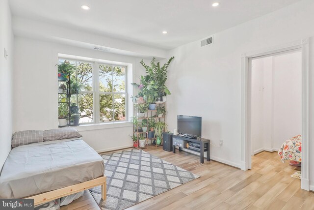 bedroom with light wood-type flooring