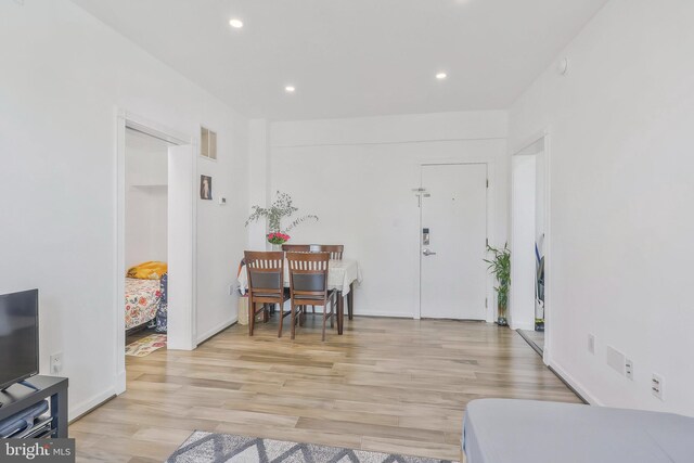 foyer entrance with light hardwood / wood-style flooring