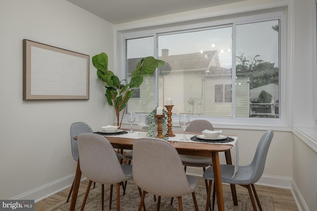 dining room with light wood-type flooring