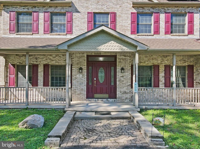 property entrance with a porch