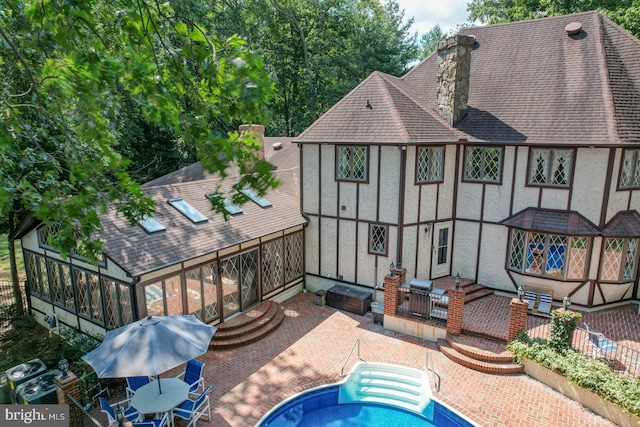 back of house featuring a patio area