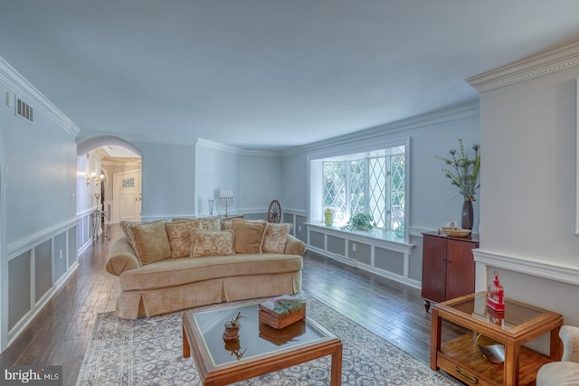 living room with ornamental molding and hardwood / wood-style flooring