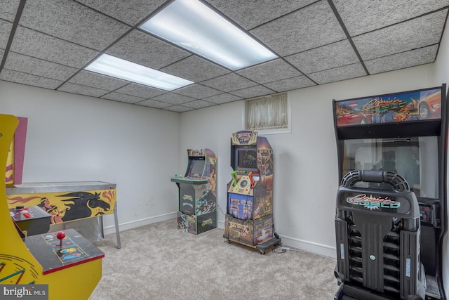 rec room featuring carpet flooring and a drop ceiling