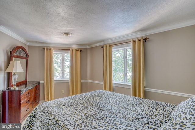 bedroom with crown molding and a textured ceiling