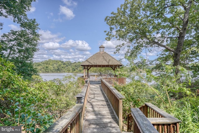 dock area with a gazebo and a water view