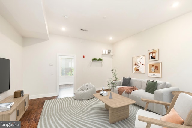 living room featuring dark hardwood / wood-style floors