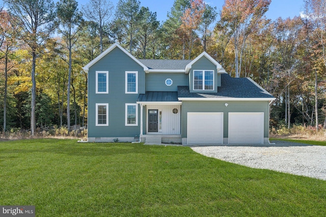 traditional-style home featuring a front yard, gravel driveway, and a garage