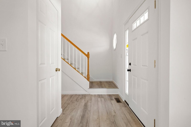 entrance foyer with light hardwood / wood-style floors