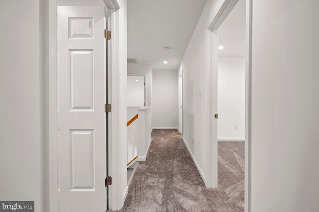 hallway with recessed lighting, baseboards, and carpet flooring