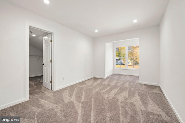 spare room with light colored carpet