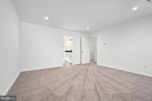 unfurnished bedroom with recessed lighting, carpet, and baseboards