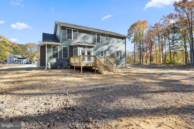 rear view of property with central air condition unit and a wooden deck