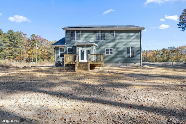 rear view of house featuring a deck