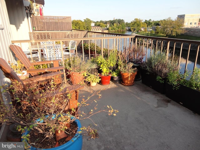 balcony featuring a water view