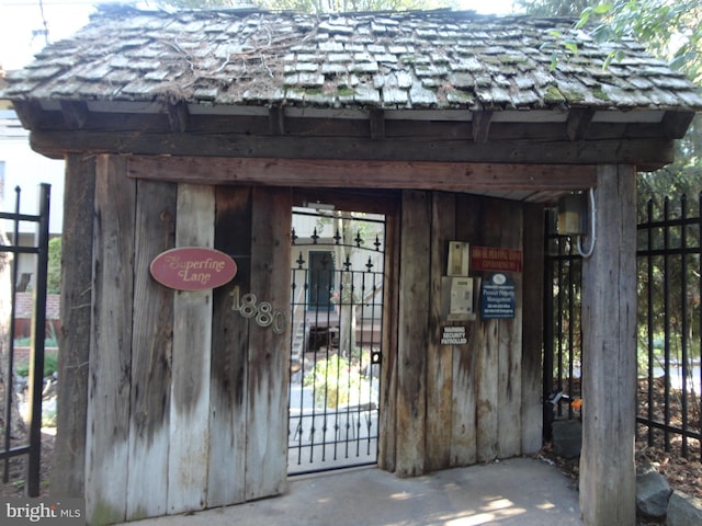 property entrance featuring fence