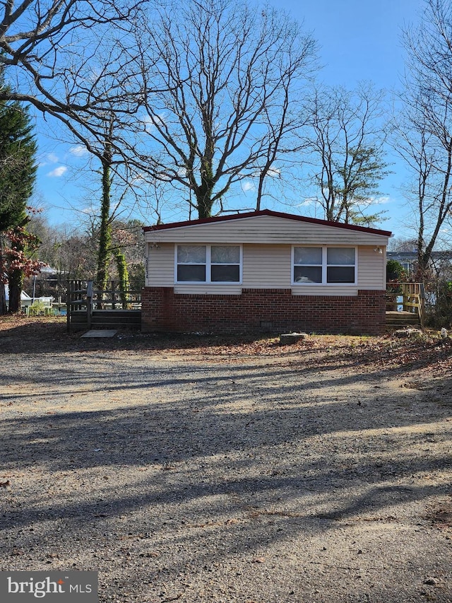 view of side of property featuring brick siding