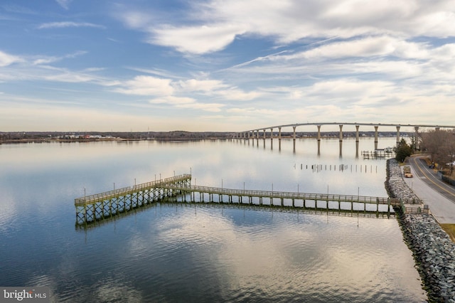 view of dock featuring a pier and a water view