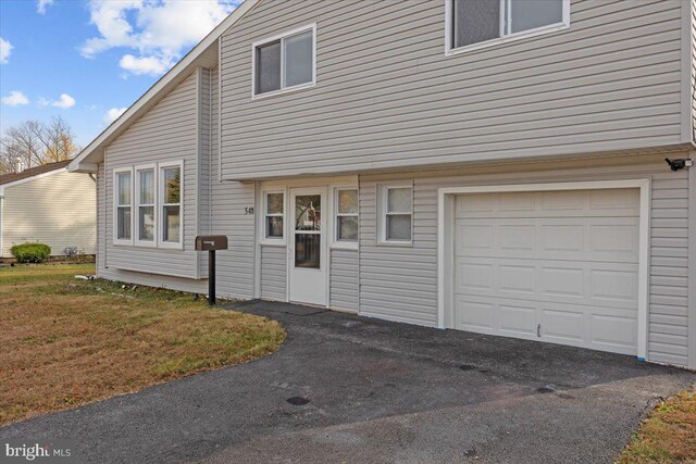 rear view of house featuring outdoor lounge area, a yard, cooling unit, and a patio