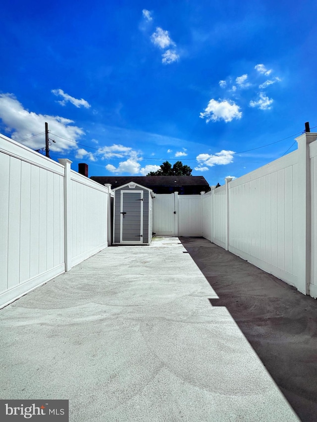 view of patio / terrace featuring a storage shed