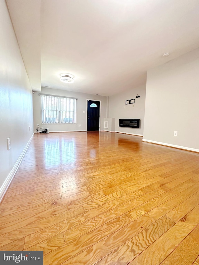 unfurnished living room featuring light hardwood / wood-style floors