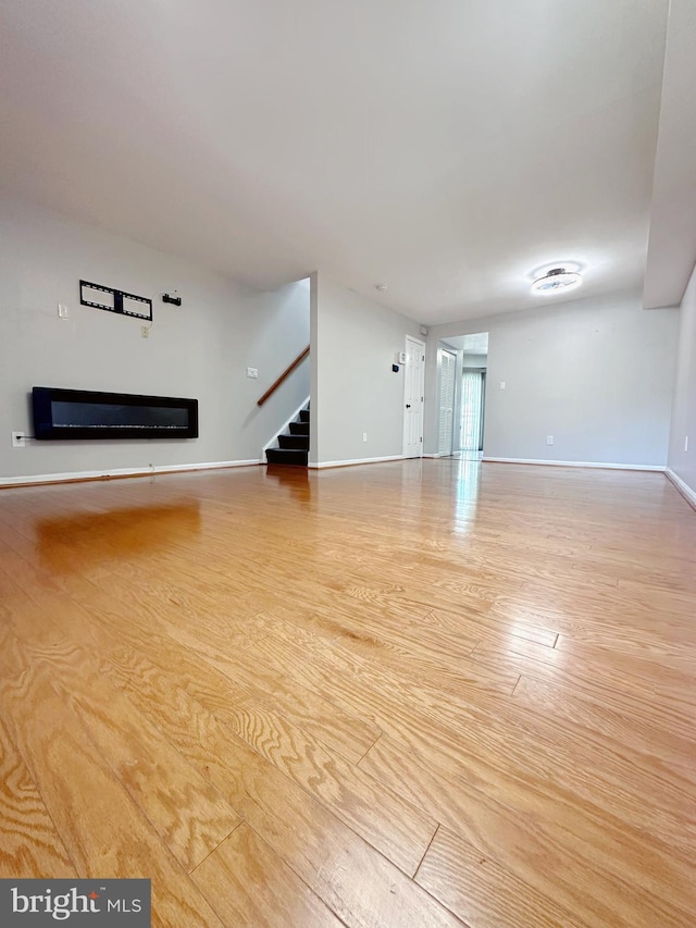 unfurnished living room with light hardwood / wood-style flooring