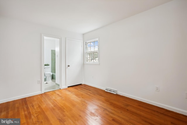 unfurnished room featuring wood-type flooring