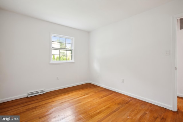 empty room featuring hardwood / wood-style floors