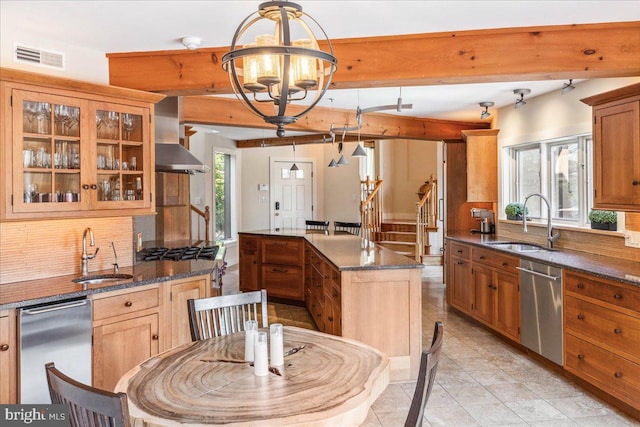 kitchen featuring dishwasher, a center island, an inviting chandelier, and sink