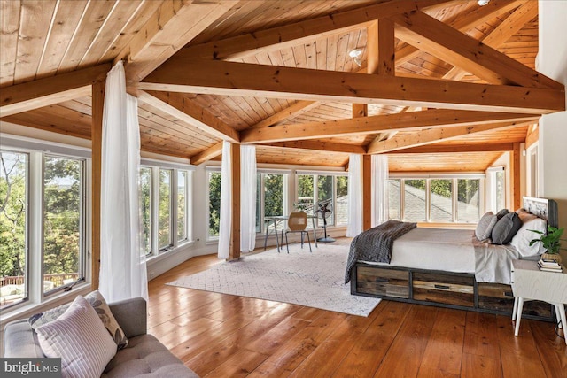 bedroom featuring hardwood / wood-style floors, wooden ceiling, and lofted ceiling with beams