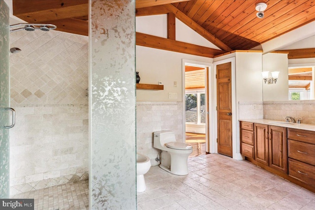 bathroom featuring toilet, vanity, vaulted ceiling with beams, tile walls, and a shower with shower door