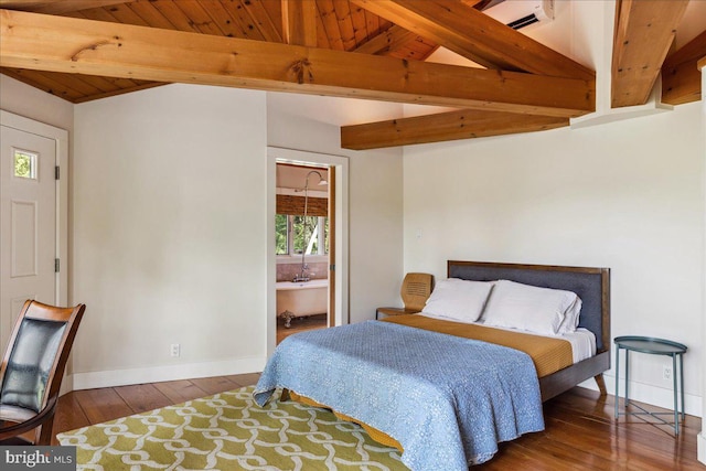 bedroom featuring lofted ceiling with beams, multiple windows, and hardwood / wood-style floors