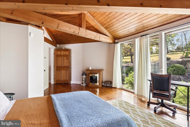 bedroom featuring lofted ceiling with beams, multiple windows, wood-type flooring, and wood ceiling