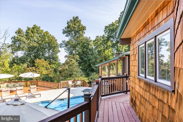 wooden terrace with a pool