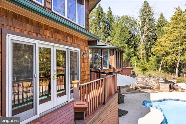 wooden deck with a patio area