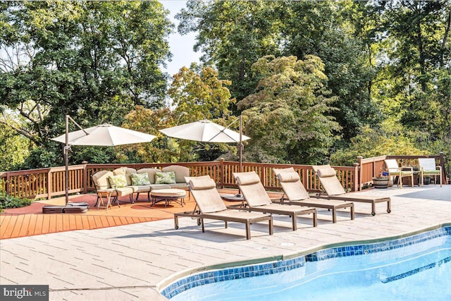 view of swimming pool featuring a deck