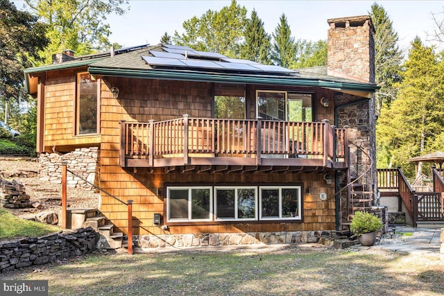 back of property with solar panels