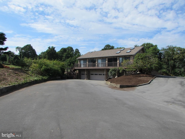 view of front of property with driveway and an attached garage