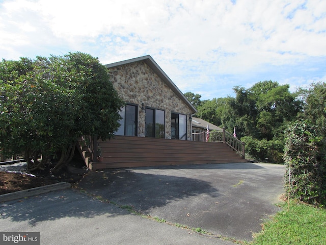 view of property exterior featuring stone siding