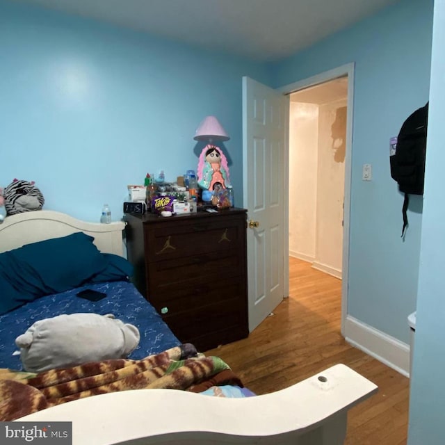 bedroom featuring hardwood / wood-style flooring