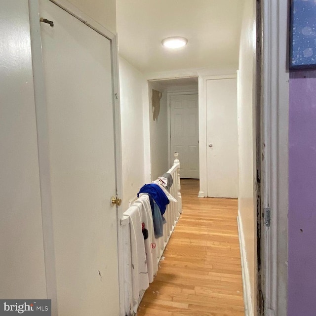 hall with light hardwood / wood-style floors