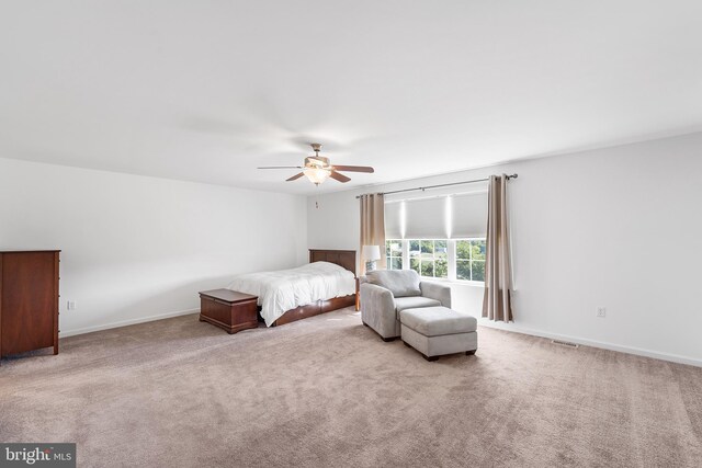 unfurnished bedroom with ceiling fan and light carpet