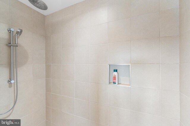 details featuring a tile shower