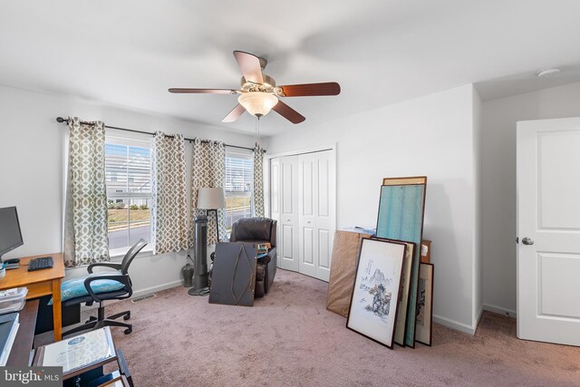 office area with ceiling fan and light colored carpet