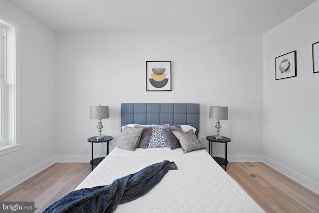 bedroom with light wood-type flooring