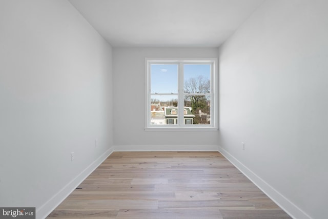 spare room with light hardwood / wood-style floors