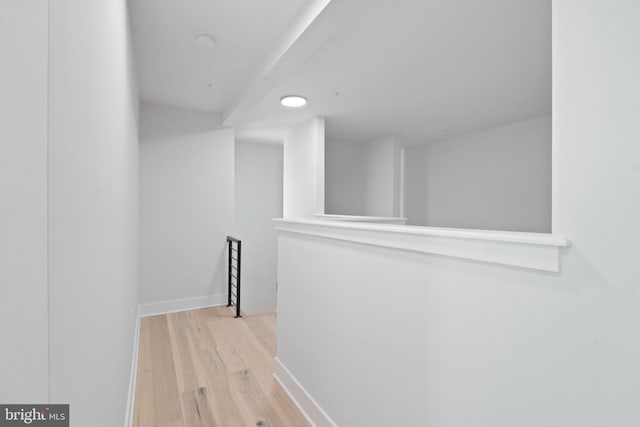 corridor with light hardwood / wood-style flooring