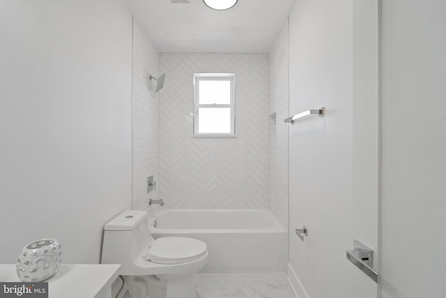 full bathroom featuring toilet, tiled shower / bath combo, and vanity