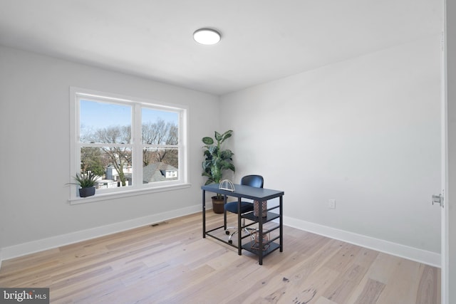 office space featuring light hardwood / wood-style floors