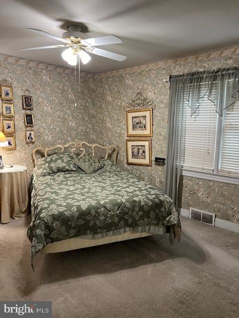 carpeted bedroom with ceiling fan