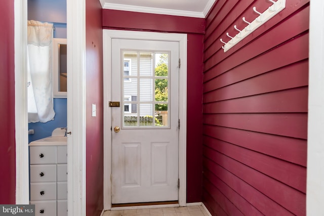 interior space featuring a sink and crown molding